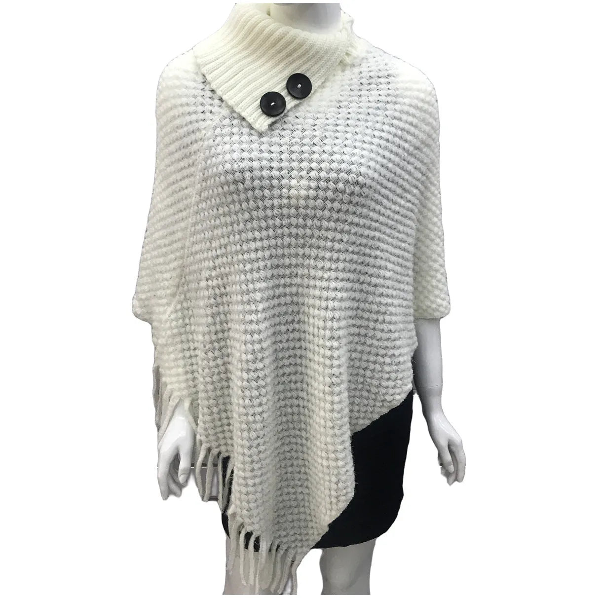 Dot-patterned acrylic knitted shawl cloak in apricot colour, laid flat.