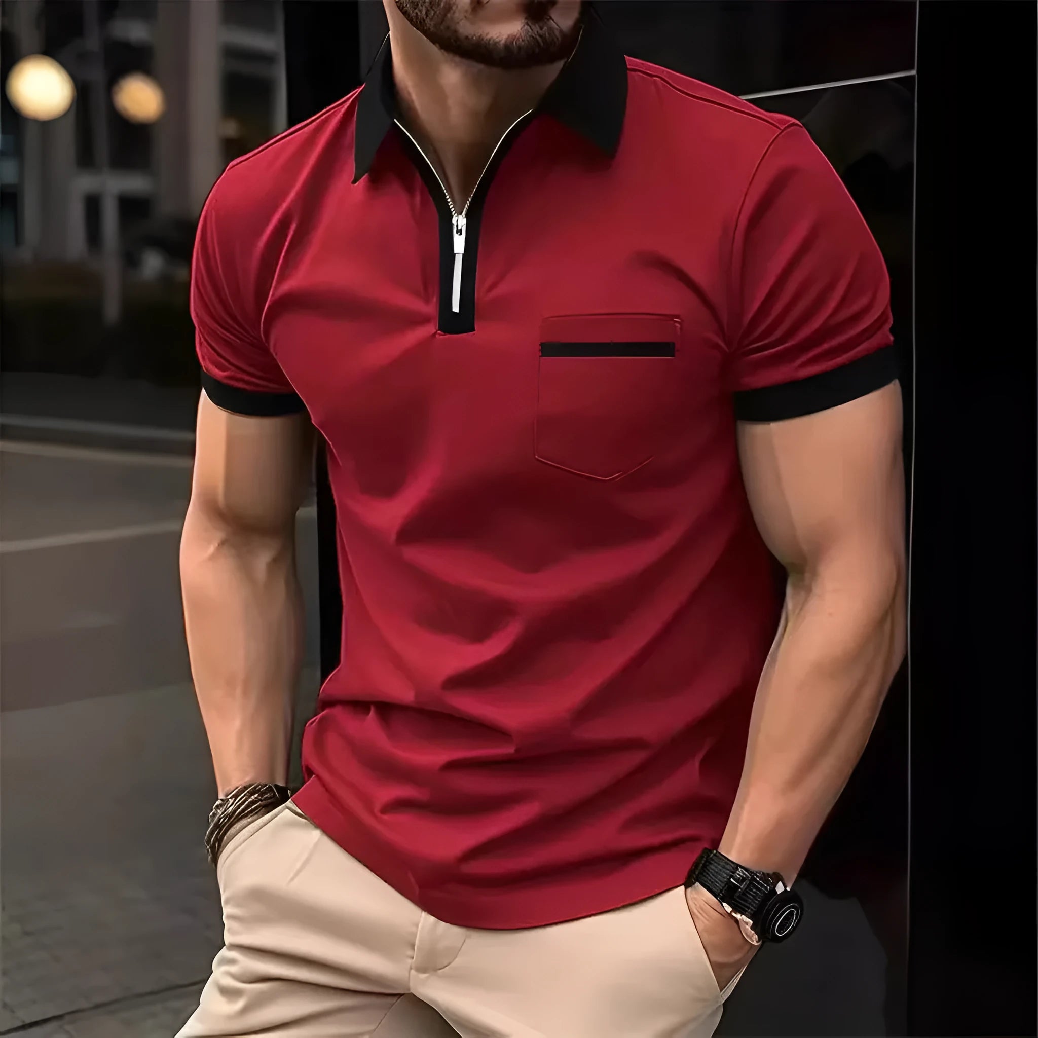 Man wearing a loose-fit short-sleeve casual shirt with a chest pocket and a zipper decoration on the front.