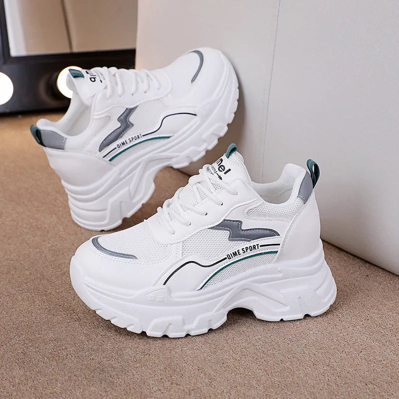 White women's lace-up dad shoes with cross straps and a breathable mesh upper.