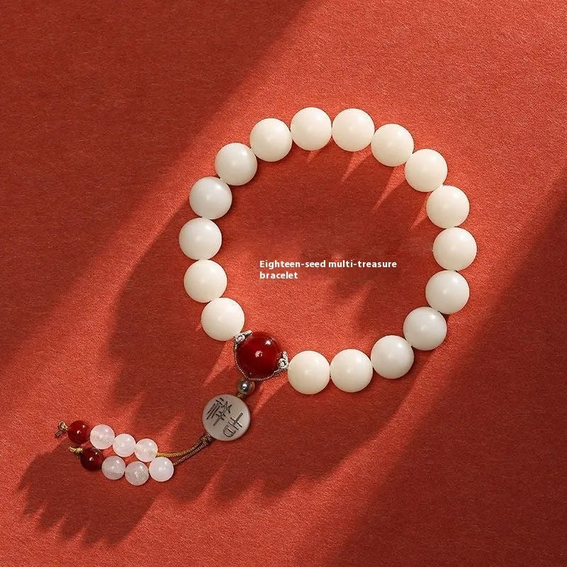 White jade Bodhi bracelet with round 10mm beads, ruyi decoration, shown in obsidian, red agate and red code brain colour variants