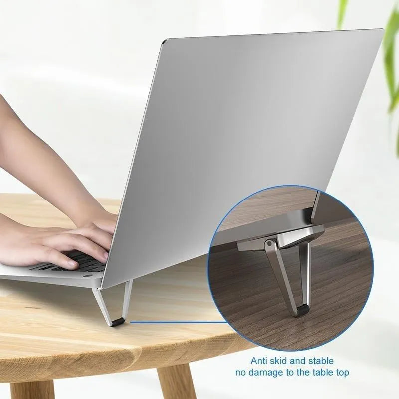 Foldable aluminium alloy laptop bracket in silver, showing compact 4.8cm size with wireless design