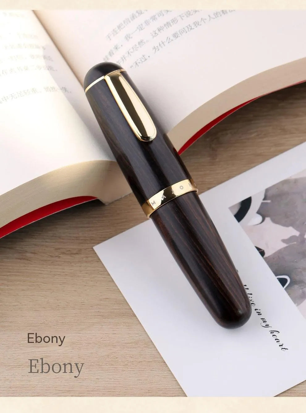 Solid wood short chubby ink pen with fine tip on wooden surface