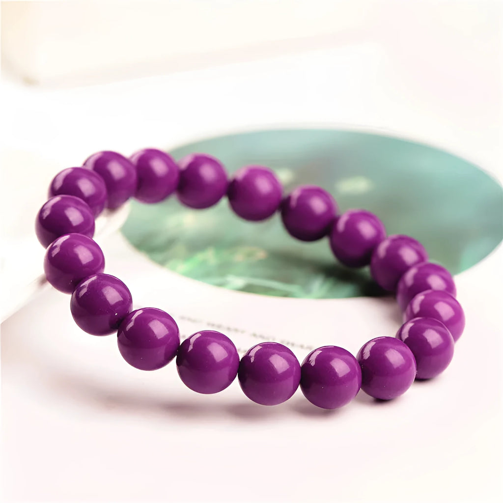 Purple mica crystal bracelet on wrist showing polished finish and single circle design.