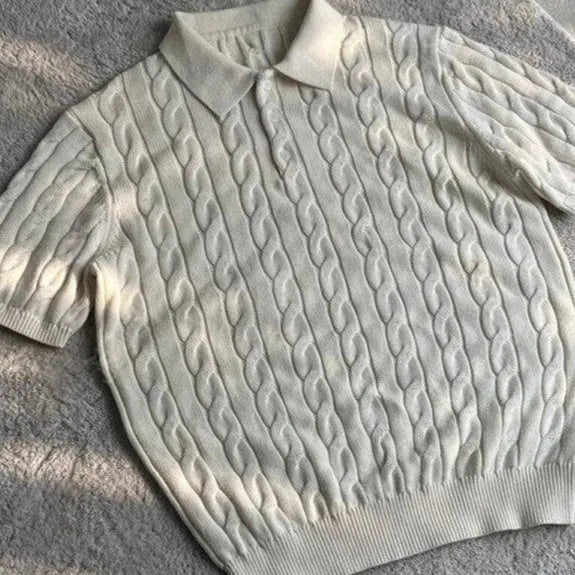 Man's grey twisted knit cotton style short sleeve T-shirt on a hanger