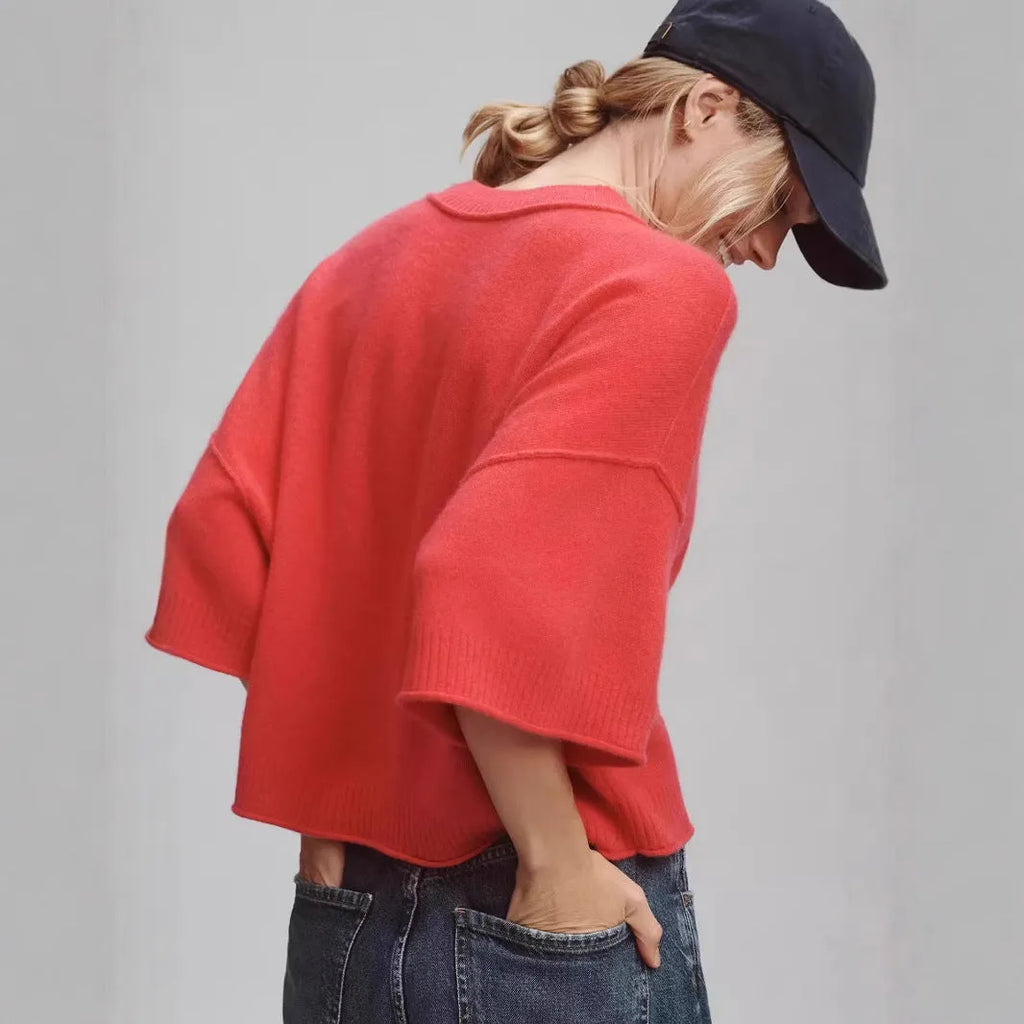 Red cropped t-shirt with exposed navel design and short sleeves on mannequin