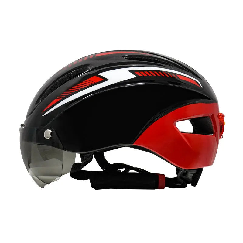 Adult bicycle helmet with integrated red taillight on the rear, shown in a black and blue colour variant.