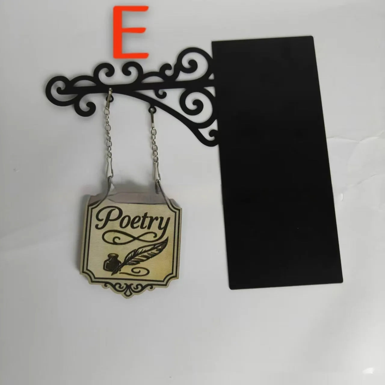 Decorative book nook divider shaped like a medieval tavern sign for shelf organisation