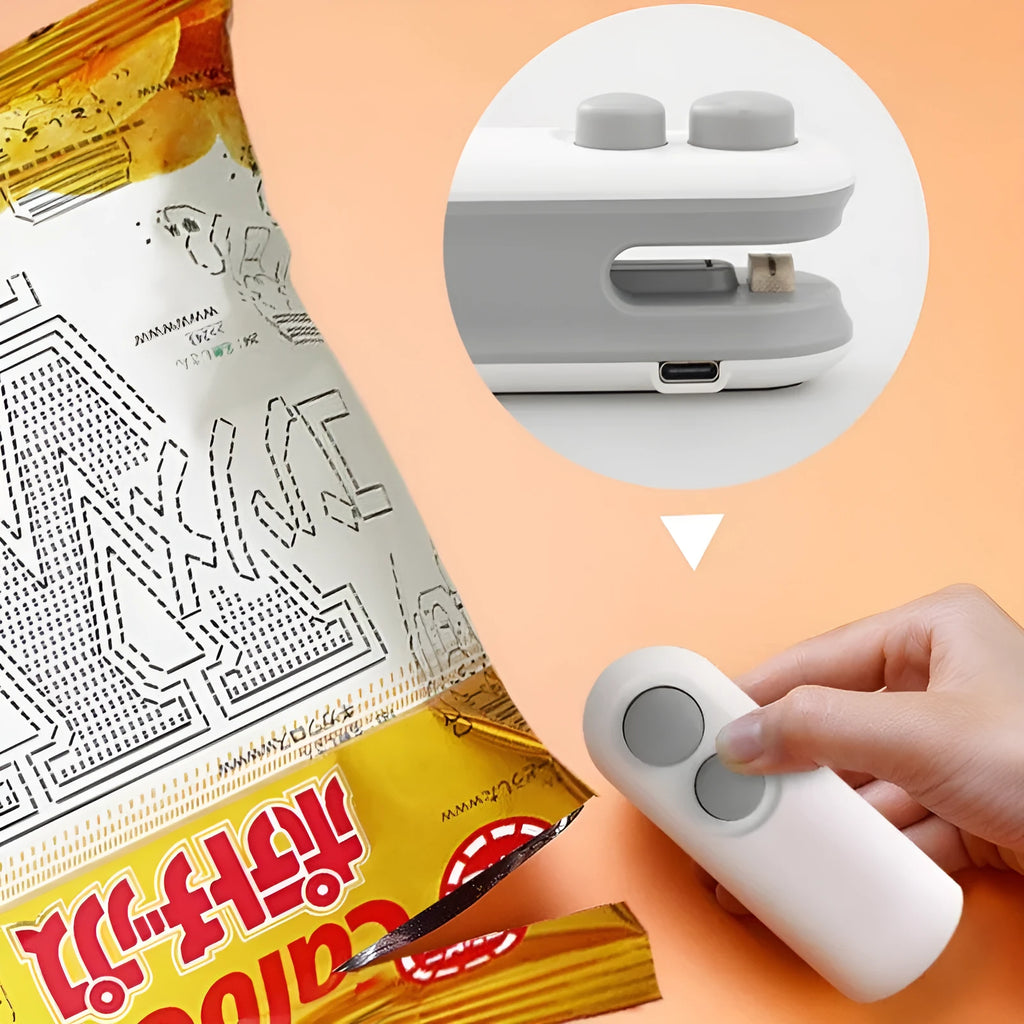White handheld vacuum sealing machine with USB charging port and magnetic back for chip bags