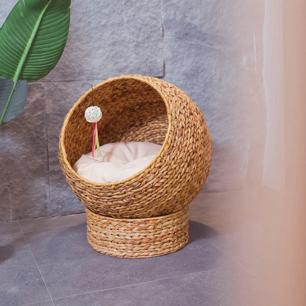 Brown woven rattan cat nest pet bed on floor with compact 50 x 57 cm size