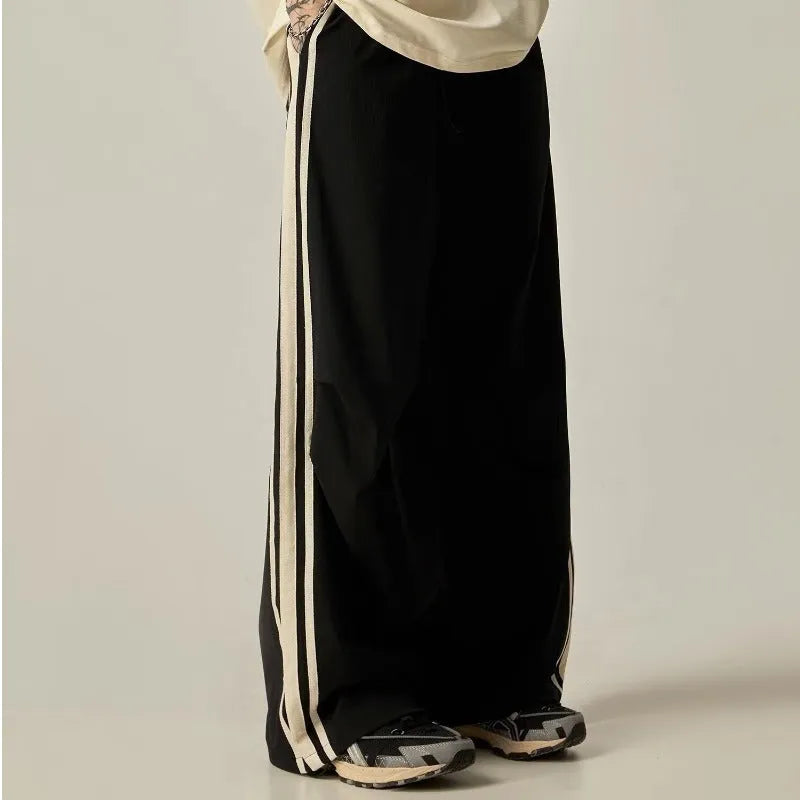 Black high-waisted wide leg straight trousers for men, made from polyester fibre.