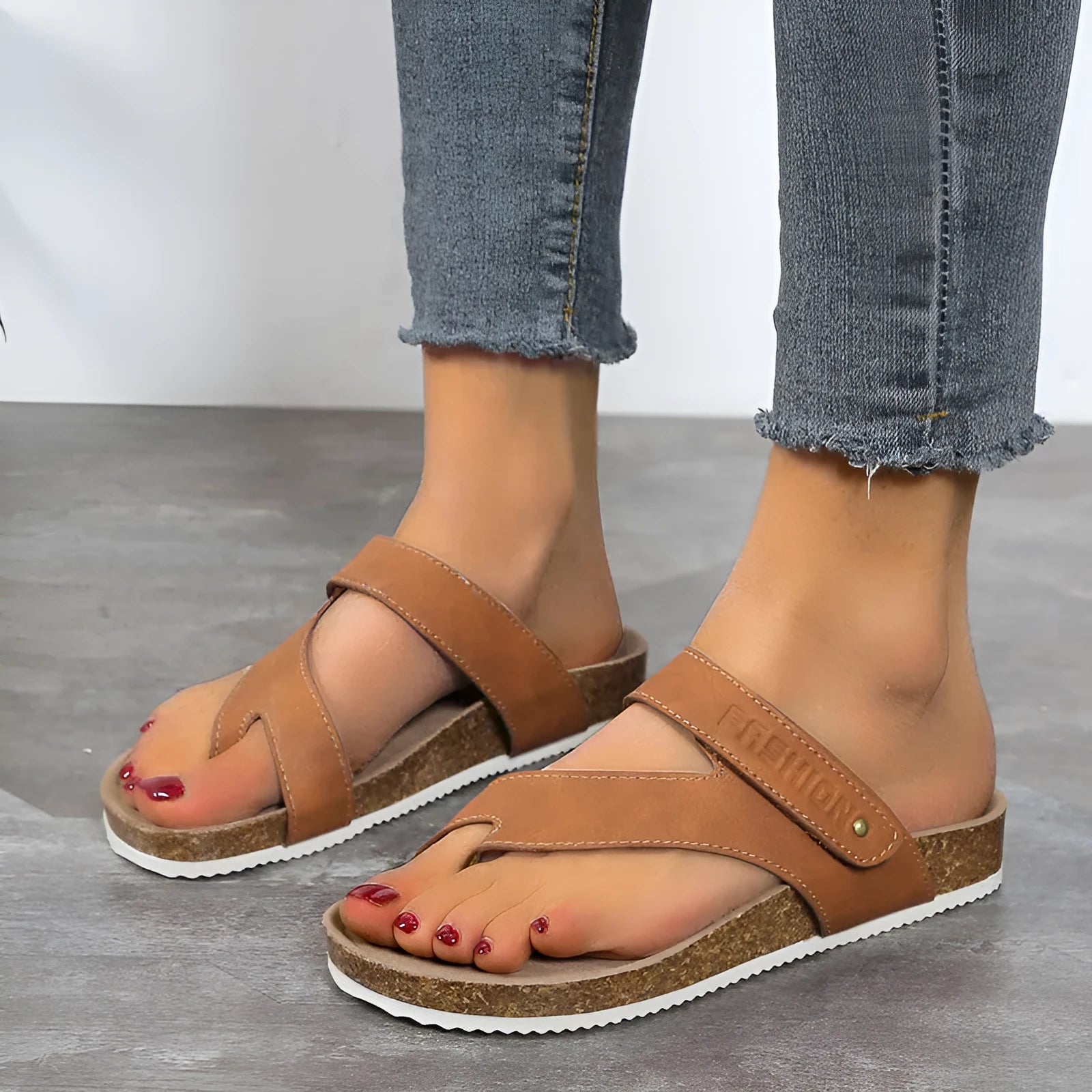 Flat toe ring thick-soled flip-flops in a solid colour on a white background.