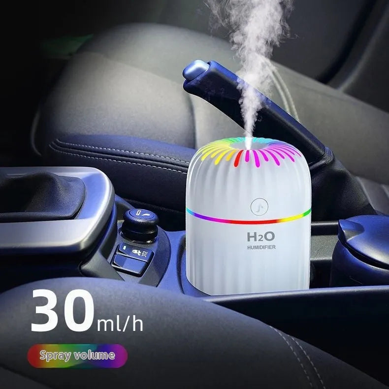Small green animal-shaped USB aromatherapy humidifier on a desk
