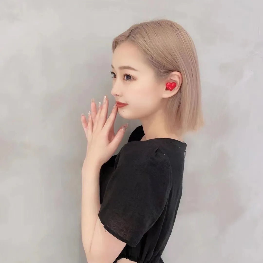 Heart-shaped wireless Bluetooth headphones in red and pink colour options