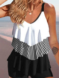 Women's backless bikini swimsuit with spaghetti straps and ruffle detailing in various colour patterns