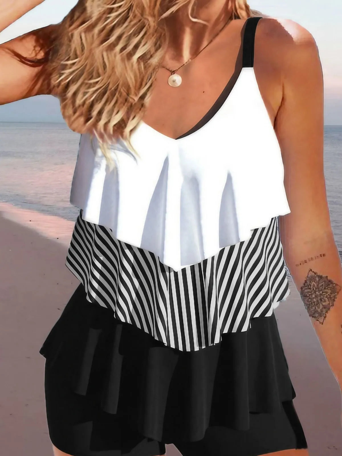 Women's backless bikini swimsuit with spaghetti straps and ruffle detailing in various colour patterns