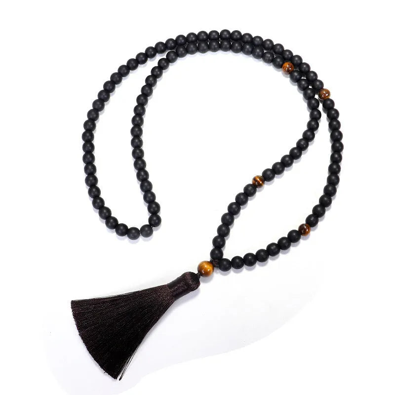 Tiger eye stone beaded necklace and bracelet set with tassel pendants on white background