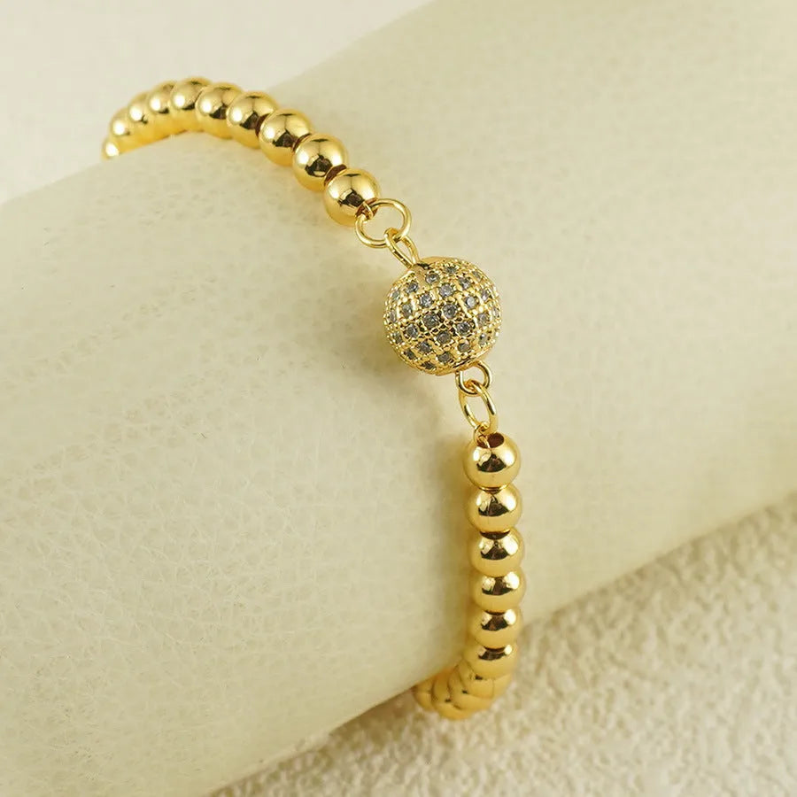 Copper heart-shaped bracelet with a single zircon stone in an Arabic style.