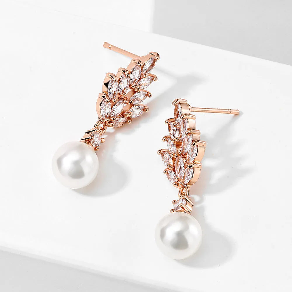 Micro inlaid zircon pearl earrings with geometric floral design in gold, platinum, or rose gold plating.