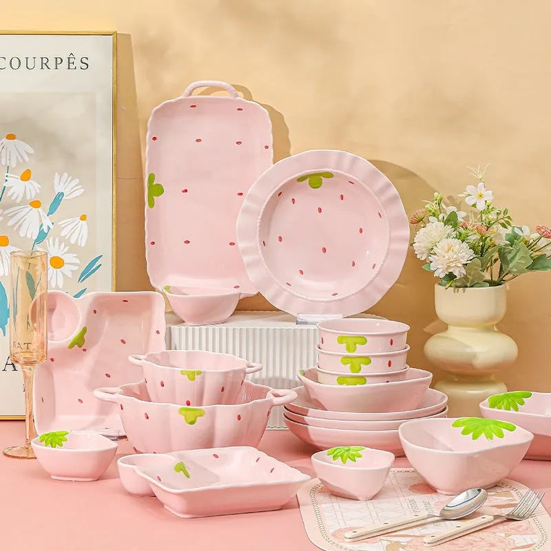 Porcelain dinnerware set with strawberry pattern includes bowls, plates, and spoon