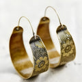 Gold geometric hollow pattern lady's earrings with petal design in Maillard style