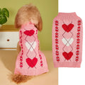Red dog jumper with a white love heart and bow design on a small dog.
