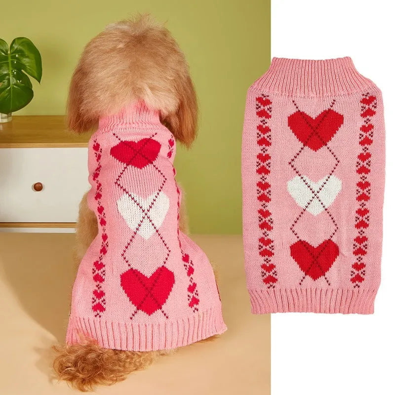 Red dog jumper with a white love heart and bow design on a small dog.