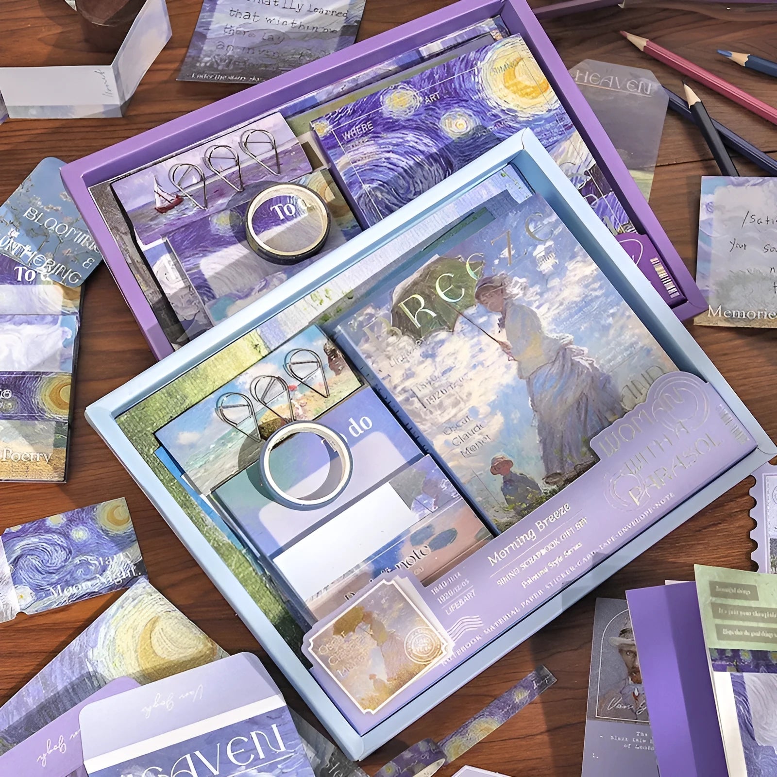 A6 creative journal gift box open to show grid notebook, bookclothes cover, material paper, cards, envelopes, stickers, and a water drop bookmark.