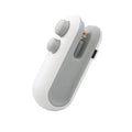 White handheld vacuum sealing machine with USB charging port and magnetic back for chip bags