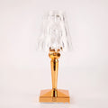 Rose gold portable touch night light with adjustable three-colour lighting on wooden surface