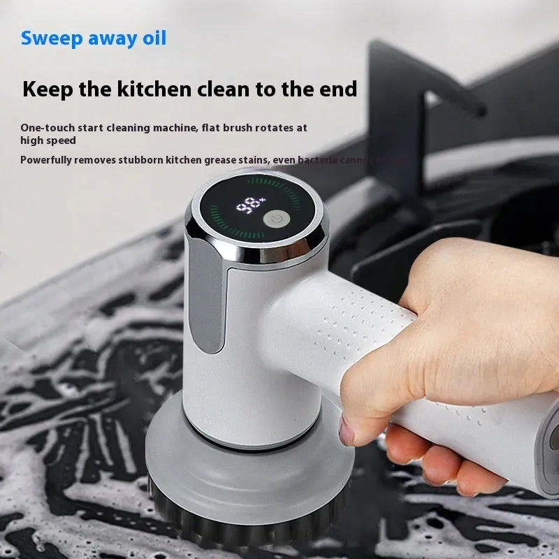 White wireless electric cleaning brush with replaceable head on a kitchen counter