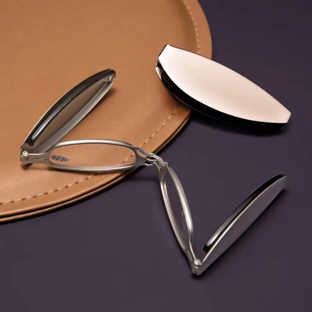 Folding presbyopic glasses in retro style with ring elements, shown in black and silver frame colours