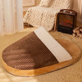 Blue dog nest sleeping bag with removable cover, shown with a small dog inside, fleece lining visible.