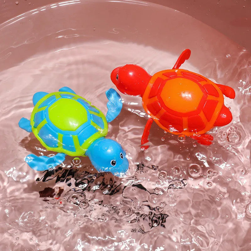 Plastic baby tortoise bath toy floating in water for bath time play