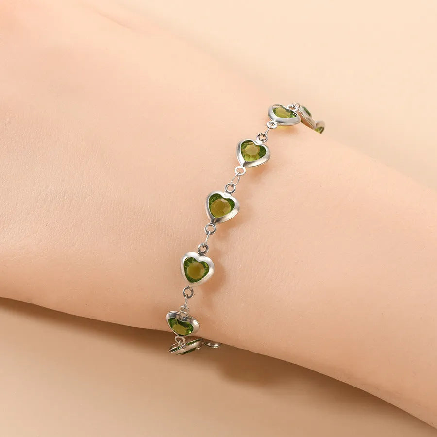 Geometry heart bracelet with devil's eye design in stainless steel showing six colour options