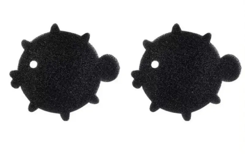 Two black bear-shaped sponge cleaning balls for pet hair removal in laundry