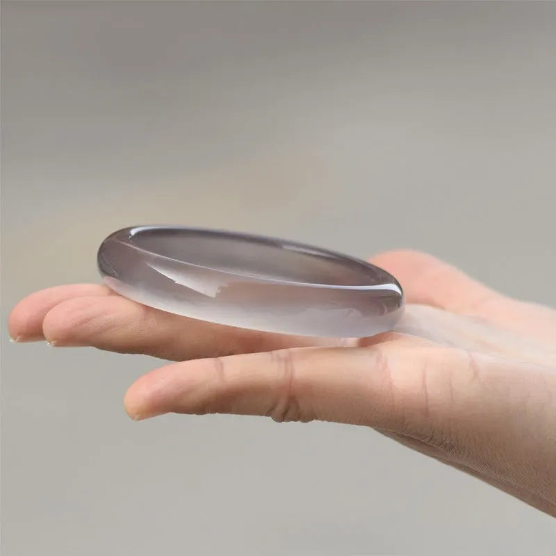 Women's dark grey Brazilian agate bracelet with natural iced chalcedony patterning and circular design elements