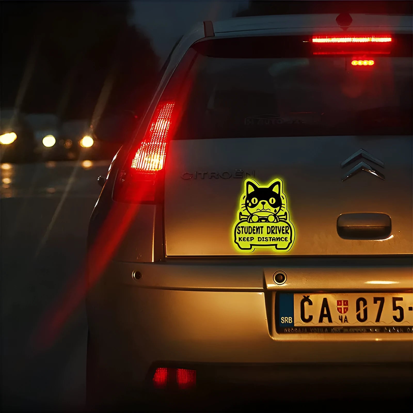 Set of three magnetic reflective car stickers showing cat, duck, and panda designs