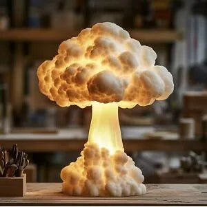 Modern art mushroom cloud atomic explosion shaped USB table lamp on a desk.