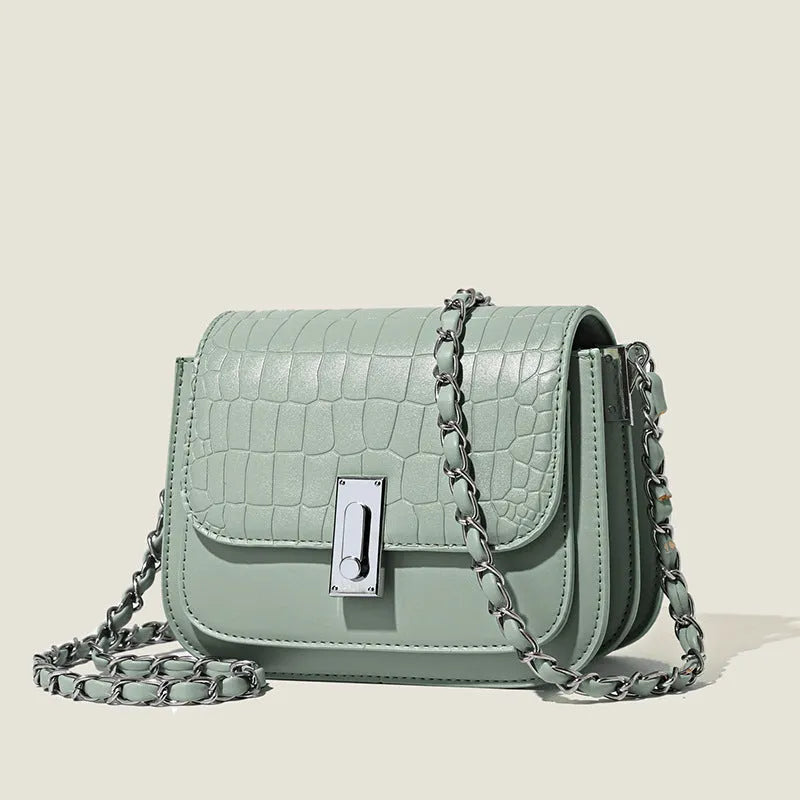 Women's soft PU chain crossbody shoulder bag in black, showing internal phone pocket and outer compartments.