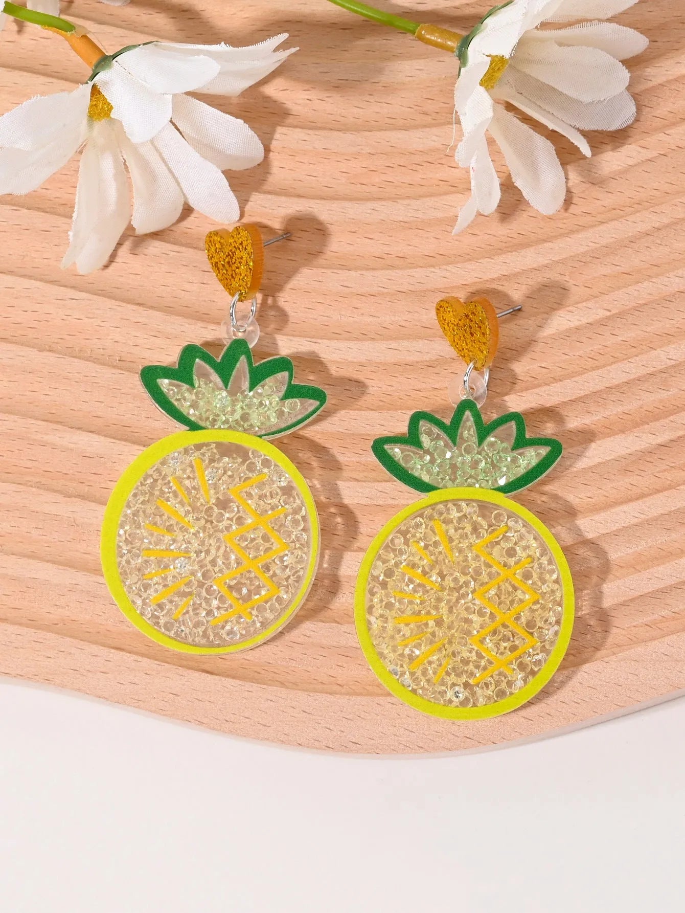 Colourful acrylic earrings with realistic fruit and dessert charms including cherry, strawberry, and ice cream.