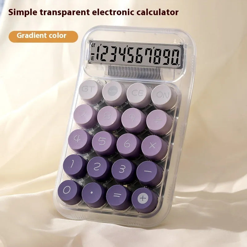 Round mechanical keyboard calculator in a muted colour with large LCD display on desk.