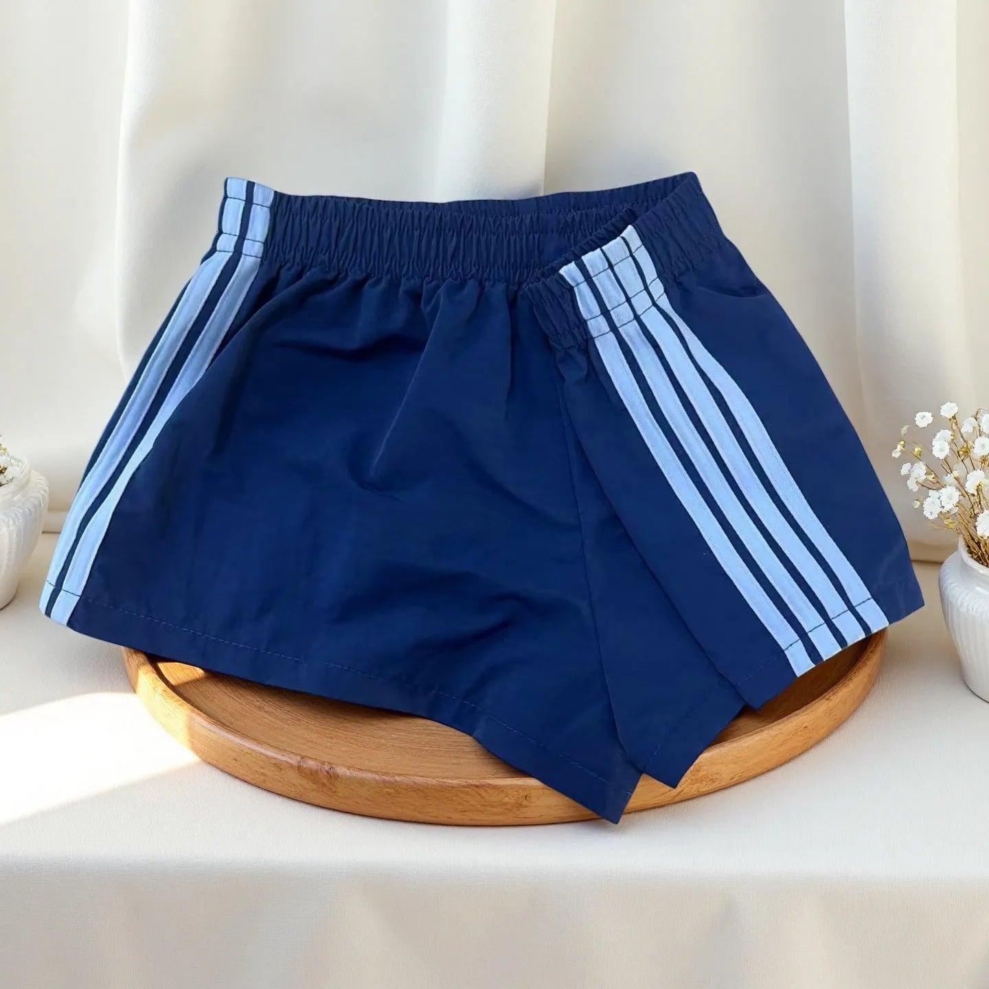 Men's navy blue nylon sport shorts with high-waist elastic waistband