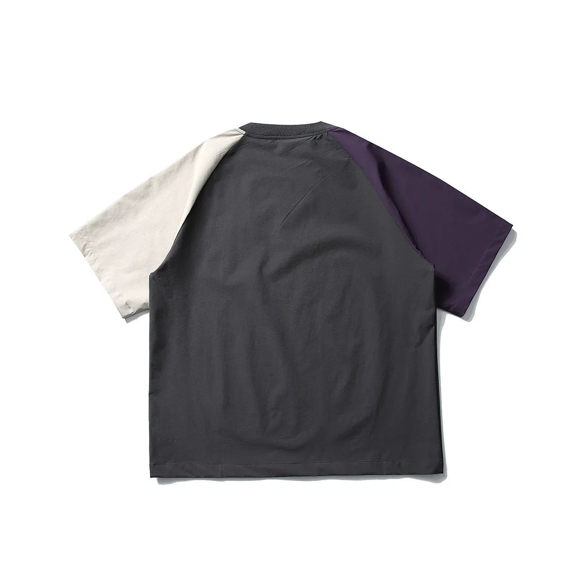 Dark grey men's loose fit t-shirt with contrasting raglan sleeves on a hanger.