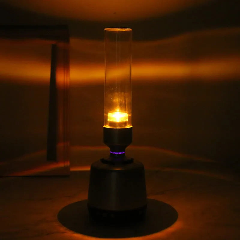 White silver candlelight Bluetooth speaker night light with modern simple design.