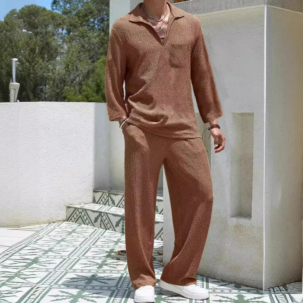 Men's casual polyester commuter suit in lake blue, showing shirt jacket and trousers laid flat.