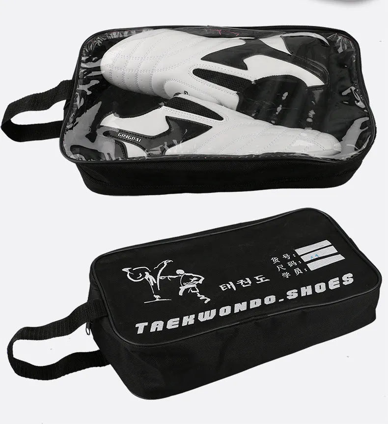 Black and white children's Sanda Taekwondo martial arts shoes with a soft sole and widened fit.