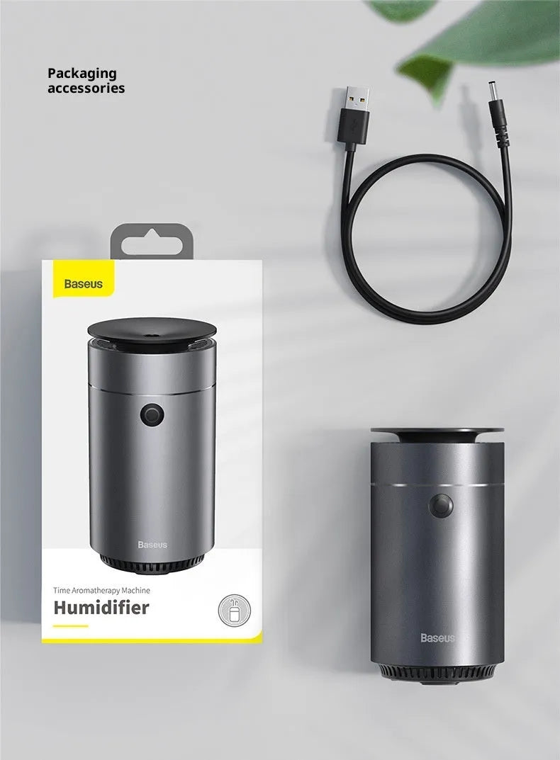 Dark gray column-shaped mini USB aromatherapy humidifier with 0.5-1L tank and single fog export.