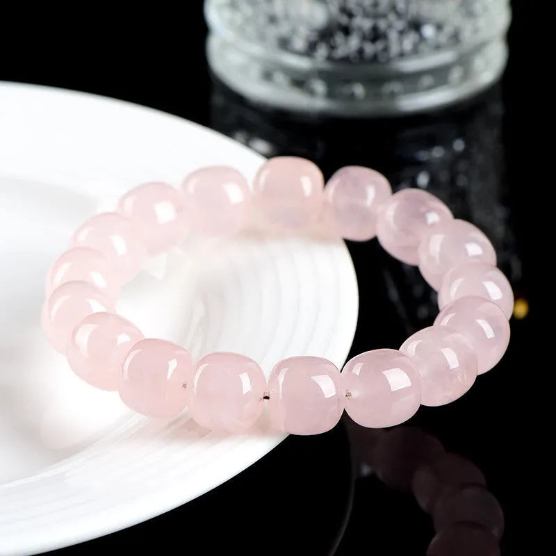 Pink bamboo and crystal barrel bead bracelet with geometric design measuring 11mm to 12mm