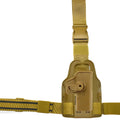 Black tactical plastic leg holster with quick-pull flap and MOLLE webbing on a belt.