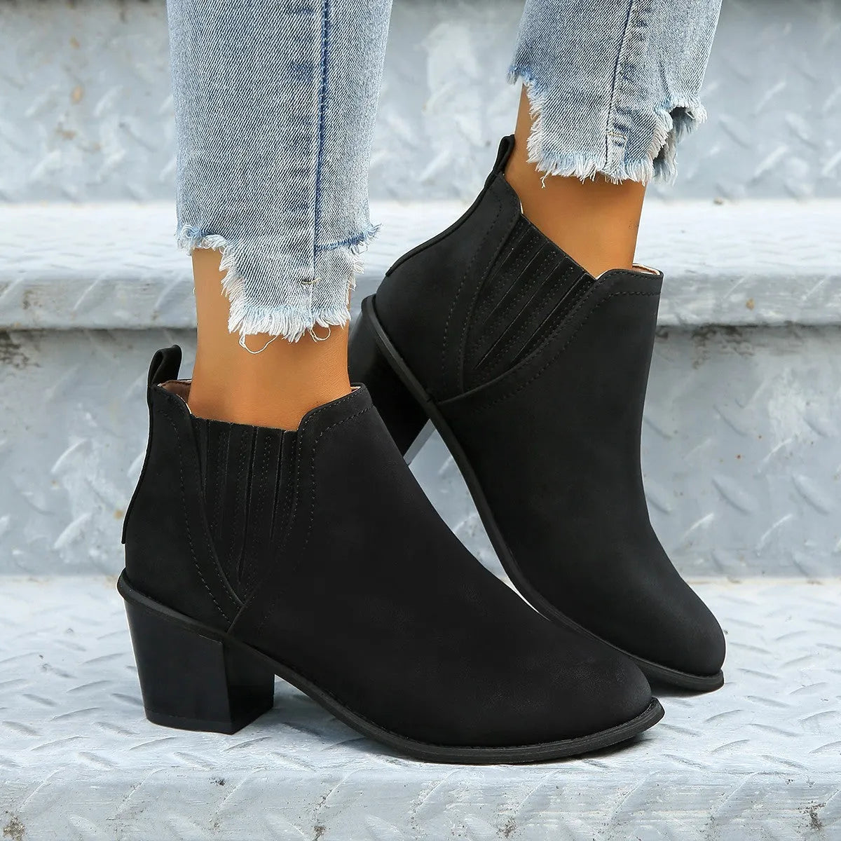 Women's black ankle boots with pointed toe and thick square low heel for autumn winter wear